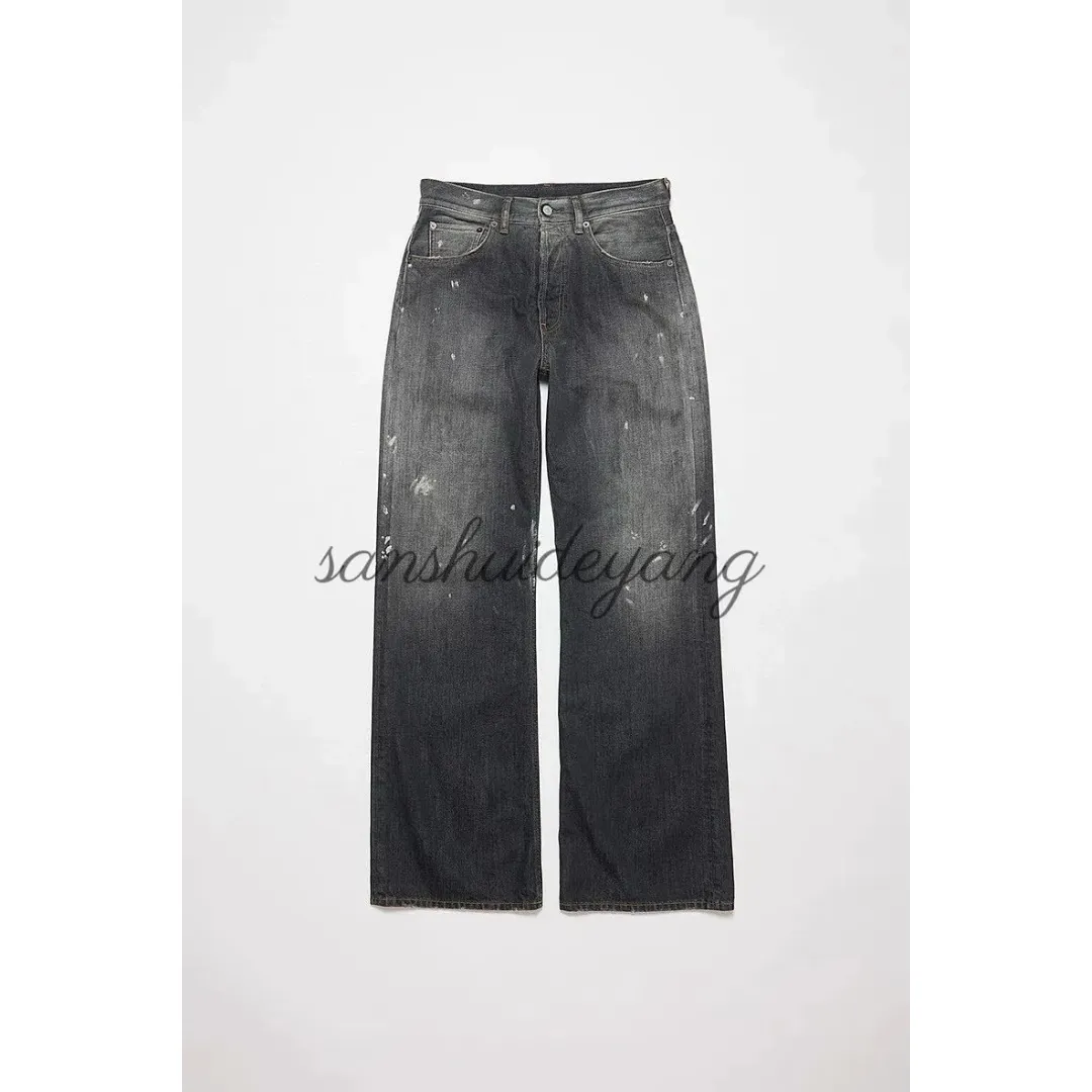 Distressed, splatter-painted black and gray wide-leg jeans