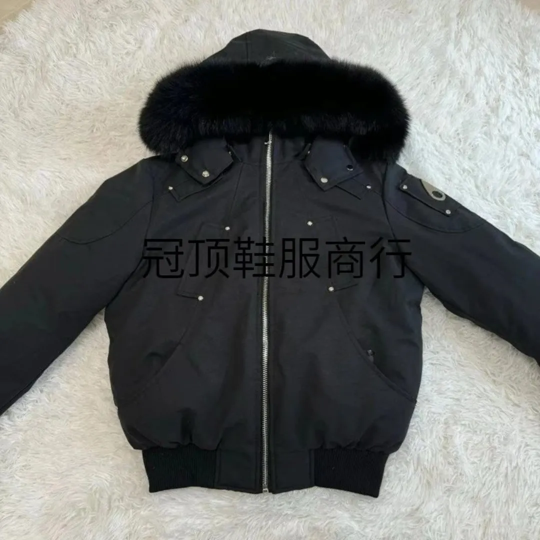 Black workwear parka with a large fur collar
